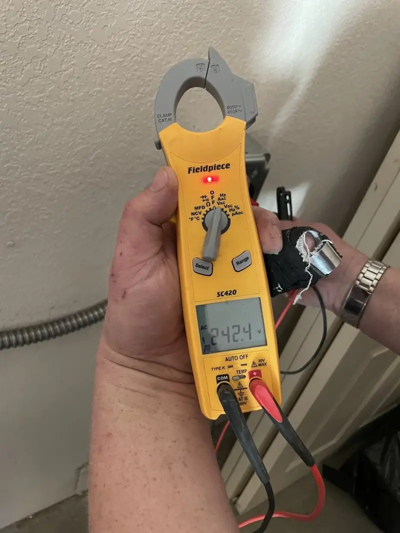 Voltage testing with clamp meter during Whole House Surge Protector in Gun Barrel City